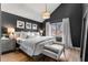 Main bedroom features a large bed, hardwood floors, black walls, and a window at 4519 Glenforest Ne Dr, Roswell, GA 30075