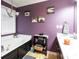 Bathroom featuring a large soaking tub, double vanities, and natural light at 531 Lindsey Way, Social Circle, GA 30025