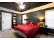 Spacious primary bedroom features a tray ceiling, and a ceiling fan at 531 Lindsey Way, Social Circle, GA 30025
