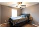 Cozy bedroom with ceiling fan and natural light creating a comfortable atmosphere at 531 Lindsey Way, Social Circle, GA 30025