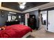 Large primary bedroom boasts dark walls, a walk-in closet, and lots of natural light at 531 Lindsey Way, Social Circle, GA 30025