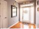Welcoming entryway features hardwood floors, natural light, and a stylish mirror to enhance the home's appeal at 531 Lindsey Way, Social Circle, GA 30025