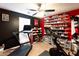 Bright exercise room with treadmill, Peloton bike, window and extensive shoe storage at 531 Lindsey Way, Social Circle, GA 30025