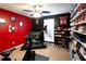 Spacious exercise room with Peloton bike, treadmill, ceiling fan and shelving for shoe storage at 531 Lindsey Way, Social Circle, GA 30025
