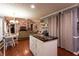 Open concept kitchen with island, and view into the living room, great for entertaining at 531 Lindsey Way, Social Circle, GA 30025