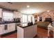 Bright kitchen featuring white cabinets, stainless appliances, and a center island at 531 Lindsey Way, Social Circle, GA 30025