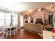 Open-concept living and dining area with a view of the fireplace, creating a seamless flow for modern living at 531 Lindsey Way, Social Circle, GA 30025