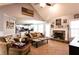Bright and airy living room showcasing a fireplace, hardwood floors, and an open layout at 531 Lindsey Way, Social Circle, GA 30025