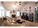 Inviting living room featuring a stone fireplace, vaulted ceilings, and ample natural light at 531 Lindsey Way, Social Circle, GA 30025