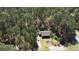 Aerial view of a secluded property surrounded by dense trees, offering privacy and tranquility at 615 Upland Nw Trl, Conyers, GA 30012