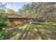 Spacious backyard surrounded by mature trees featuring a trampoline at 615 Upland Nw Trl, Conyers, GA 30012