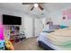 A charming bedroom with a TV and feminine decor elements at 615 Upland Nw Trl, Conyers, GA 30012