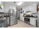 Modern kitchen with stainless steel appliances, white cabinets, subway tile backsplash, and ample counter space at 615 Upland Nw Trl, Conyers, GA 30012