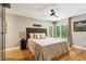 Cozy bedroom with hardwood floors, soft lighting, large windows, and neutral decor at 240 W Spalding Dr, Sandy Springs, GA 30328