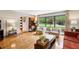 Bright living room with hardwood floors, large window with view of exterior and neutral decor at 240 W Spalding Dr, Sandy Springs, GA 30328