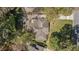 Aerial view of house with wooden deck and patio surrounded by lush landscaping and mature trees in a residential neighborhood at 2992 Westminster Nw Cir, Atlanta, GA 30327