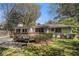 Backyard featuring a deck, patio, and well-maintained lawn, offering ample space for outdoor activities and relaxation at 2992 Westminster Nw Cir, Atlanta, GA 30327