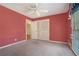 Bedroom with carpet flooring, ceiling fan, and a view of the neighborhood at 2992 Westminster Nw Cir, Atlanta, GA 30327