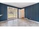 Bright dining room features a tile floor and large window views of the well-manicured front yard at 2992 Westminster Nw Cir, Atlanta, GA 30327