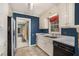 This kitchen has stainless appliances, white cabinets, and granite countertops at 2992 Westminster Nw Cir, Atlanta, GA 30327