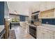 Bright kitchen features white cabinets, stainless appliances, and an eat-in island with seating at 2992 Westminster Nw Cir, Atlanta, GA 30327