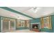 Spacious living room features a fireplace, large windows, and a bright ambiance at 2992 Westminster Nw Cir, Atlanta, GA 30327