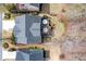 Aerial view of a home showcasing the spacious backyard with deck, patio, fire pit, and lush landscaping at 3225 Suffolk Dr, Cumming, GA 30041