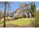 Exterior of a two-story home with a spacious backyard and outdoor patio area at 3225 Suffolk Dr, Cumming, GA 30041