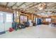 Large, unfinished basement with exposed ceiling and a variety of equipment and storage at 3225 Suffolk Dr, Cumming, GA 30041