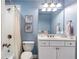 Bathroom featuring a shower with a curtain and a large, well-lit mirror at 3225 Suffolk Dr, Cumming, GA 30041