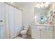 Bathroom featuring a shower curtain and modern fixtures at 3225 Suffolk Dr, Cumming, GA 30041