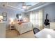 Charming bedroom featuring a tray ceiling, plantation shutters, and a guitar at 3225 Suffolk Dr, Cumming, GA 30041