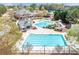 Community pool featuring a slide, wading pool, lap pool, clubhouse, and lounge area for residents' enjoyment at 3225 Suffolk Dr, Cumming, GA 30041