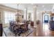 Formal dining room showcasing a large table, chandelier, hardwood floors, and elegant decor at 3225 Suffolk Dr, Cumming, GA 30041