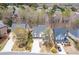 Charming neighborhood street featuring a two-story home with brick accents, a three car garage, and manicured landscaping at 3225 Suffolk Dr, Cumming, GA 30041