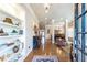 Elegant foyer with hardwood floors, built-in shelves, and an open view of the dining room at 3225 Suffolk Dr, Cumming, GA 30041
