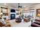 Comfortable living room with a fireplace, built-in shelving, neutral color palette, and plenty of natural light at 3225 Suffolk Dr, Cumming, GA 30041
