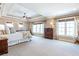 Spacious main bedroom featuring a tray ceiling, plush carpet, and large windows for natural light at 3225 Suffolk Dr, Cumming, GA 30041