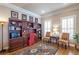 Elegant home office with custom built-ins, hardwood floors, and natural light at 3225 Suffolk Dr, Cumming, GA 30041