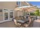 Expansive backyard patio with dining and seating areas, perfect for entertaining at 3225 Suffolk Dr, Cumming, GA 30041