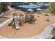 A community playground features multiple slides, swings and covered platforms next to tennis courts at 3225 Suffolk Dr, Cumming, GA 30041