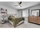 Bedroom featuring a cozy bed with a green throw blanket, a dresser, and a window at 6940 Roswell Rd # 5B, Atlanta, GA 30328