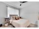 Cozy bedroom with a neutral color scheme, soft bedding, and lots of pillows at 6940 Roswell Rd # 5B, Atlanta, GA 30328