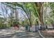 Well-maintained community dog park with trees and benches at 6940 Roswell Rd # 5B, Atlanta, GA 30328