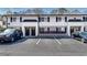 Exterior view of townhomes with parking spaces at 6940 Roswell Rd # 5B, Atlanta, GA 30328