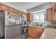 Modern kitchen area featuring granite countertops and stainless steel appliances at 6940 Roswell Rd # 5B, Atlanta, GA 30328