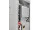 Laundry closet with stacked washer and dryer unit at 6940 Roswell Rd # 5B, Atlanta, GA 30328