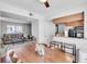 Open concept living area with a dining space and view into the living room with comfortable seating at 6940 Roswell Rd # 5B, Atlanta, GA 30328