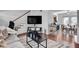 Bright living room leading to the kitchen and dining area at 6940 Roswell Rd # 5B, Atlanta, GA 30328
