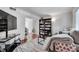 Cozy living room featuring a sofa, shelving and natural light at 6940 Roswell Rd # 5B, Atlanta, GA 30328